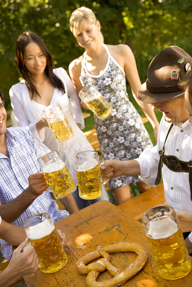 Friends in beergarden near Lake Starnberg, Bavaria, Germany