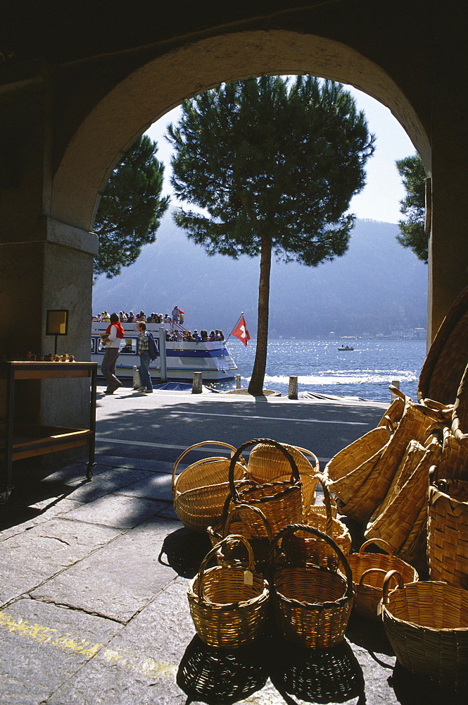 View through an archway towards Lake Lugano, Morcote, Ticino, Switzerland