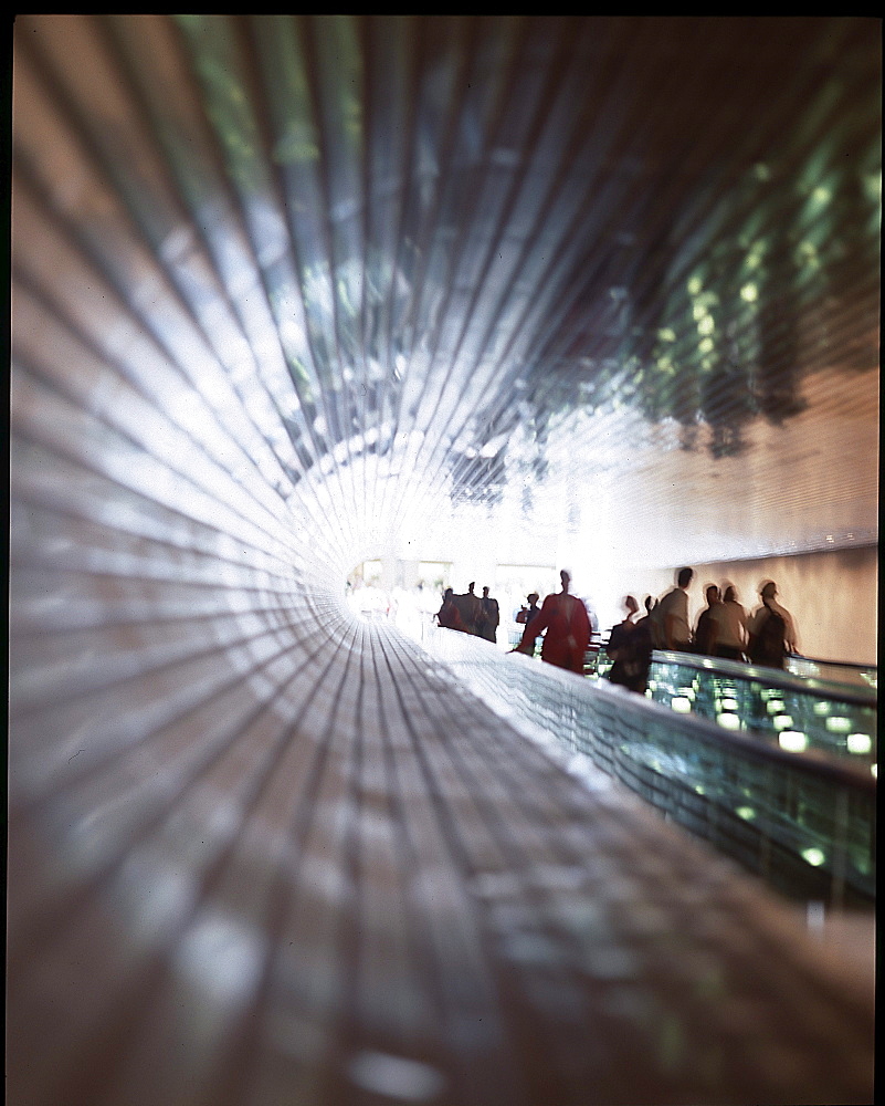 People on an escalator at the National Gallery, Washington D.C., USA, America