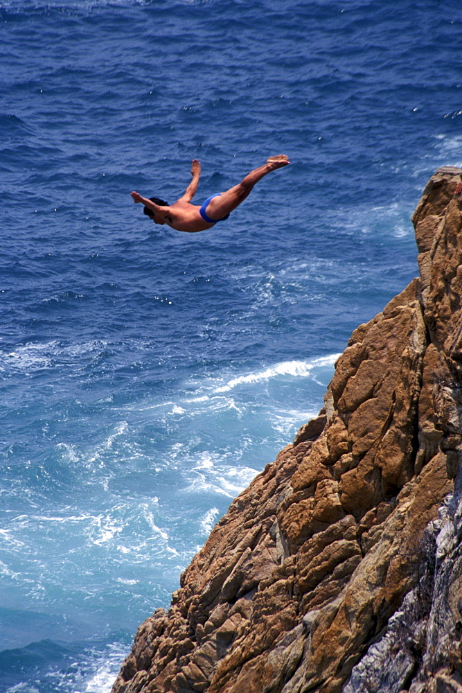 Cliff diver during jump, Acapulco, Guerrero, Mexico, America