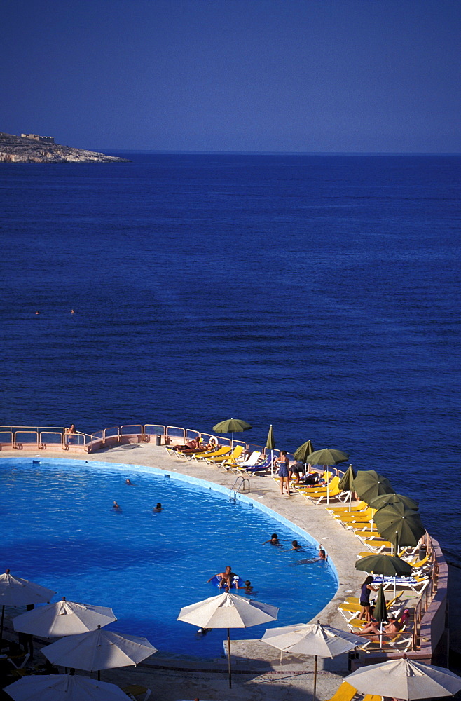 People at the pool of Comino Hotel, Comino Island, Malta, Europe