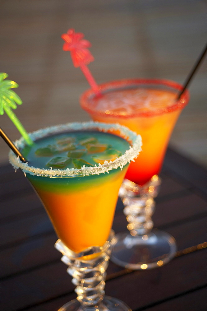 Colourful cocktails at the pool of Hotel Restaurant Le Rayon Vert in the evening, Deshaies, Basse-Terre, Guadeloupe, Caribbean Sea, America