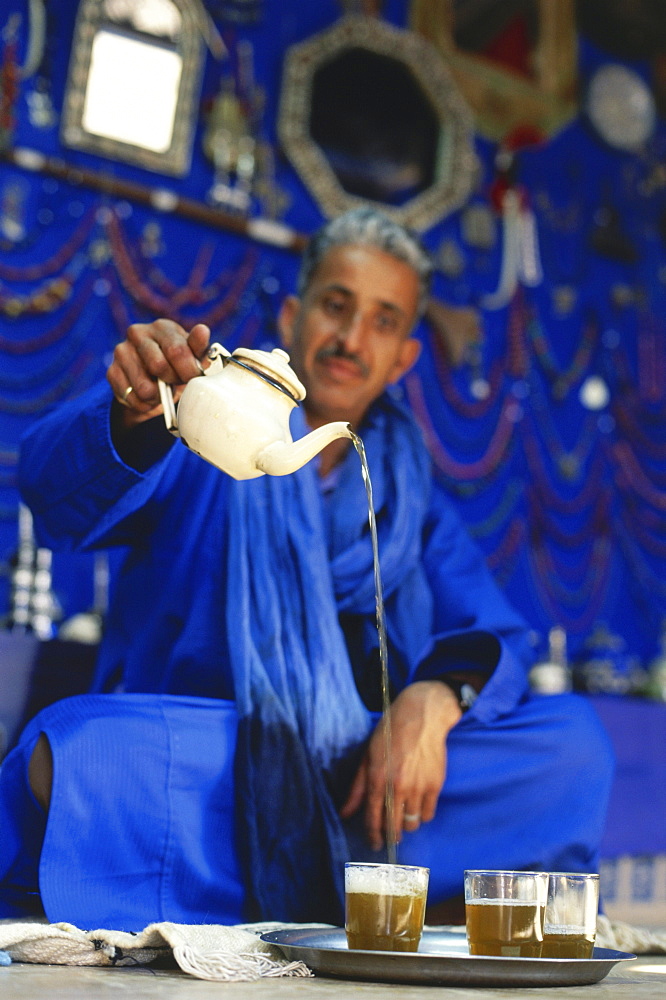 Tuareg Mohamed Jallali pouring peppermint tea into a glass, Essaouira, Marocco