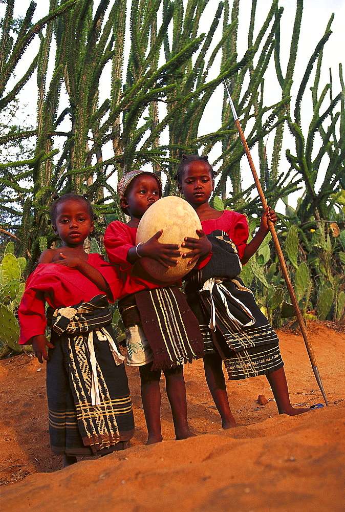 Antandroy children with giant bird's egg, South Madagascar