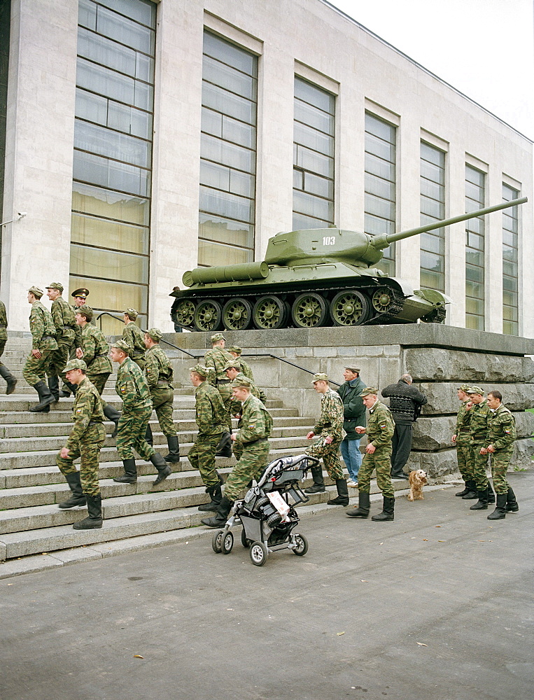 Soldiers climbing stairs in front of the Central Armed Forces Museum, Moscow, Russia