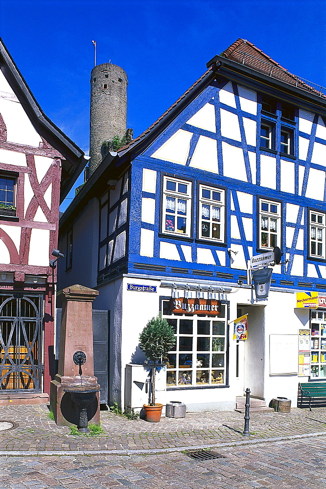 Half timbered houses and castle ruin under blue sky, Eppstein, Taunus, Hesse, Germany, Europe