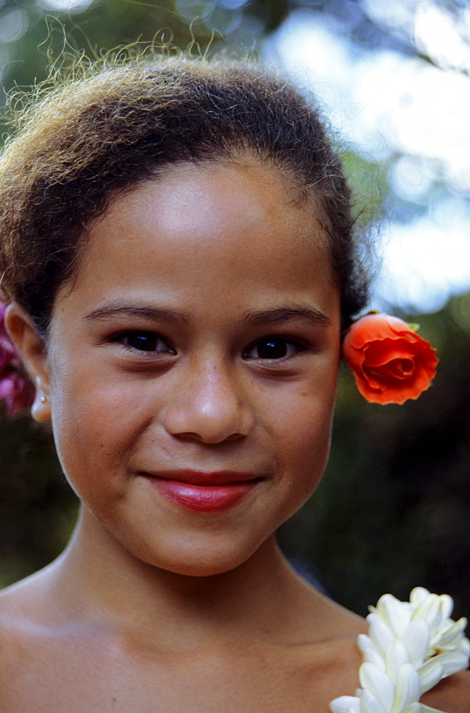 Portrait of a young girl with a flower in her hair, dancer, Ua Huka, Marquesas French Polynesia, South Pacific