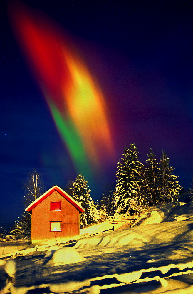 Colourful lights above snow covered house, Oslo, Norway, Scandinavia, Europe