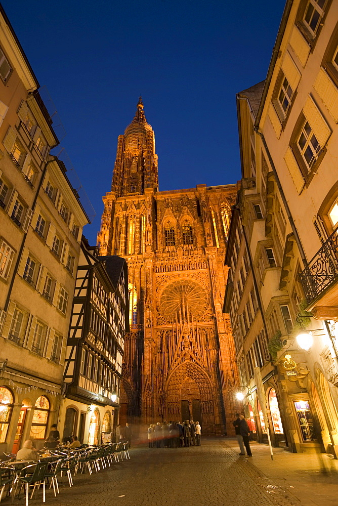 View through the Rue Merciere to the Our Lady's Cathedral, View through the Rue Merciere with a pavement cafe to the western facade of the Our Lady's Cathedral Cathedrale Notre-Dame, Rue Merciere, Strasbourg, Alsace, France