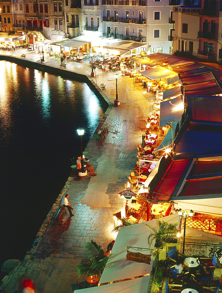 Illuminated Venetian Harbour at night with restaurants, Chania, Crete, Greece