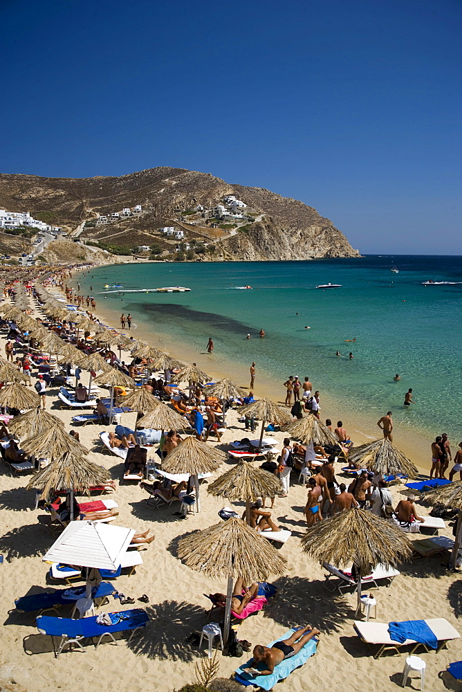 View to the Elia Beach with a lot of sunshades and bathers, Elia, Mykonos, Greece