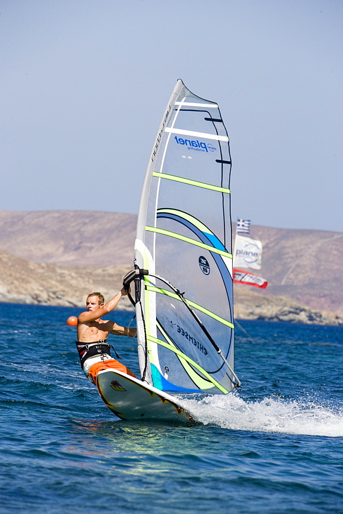 Surfer in action at Kalafati Beach, Kalafati, Mykonos, Greece