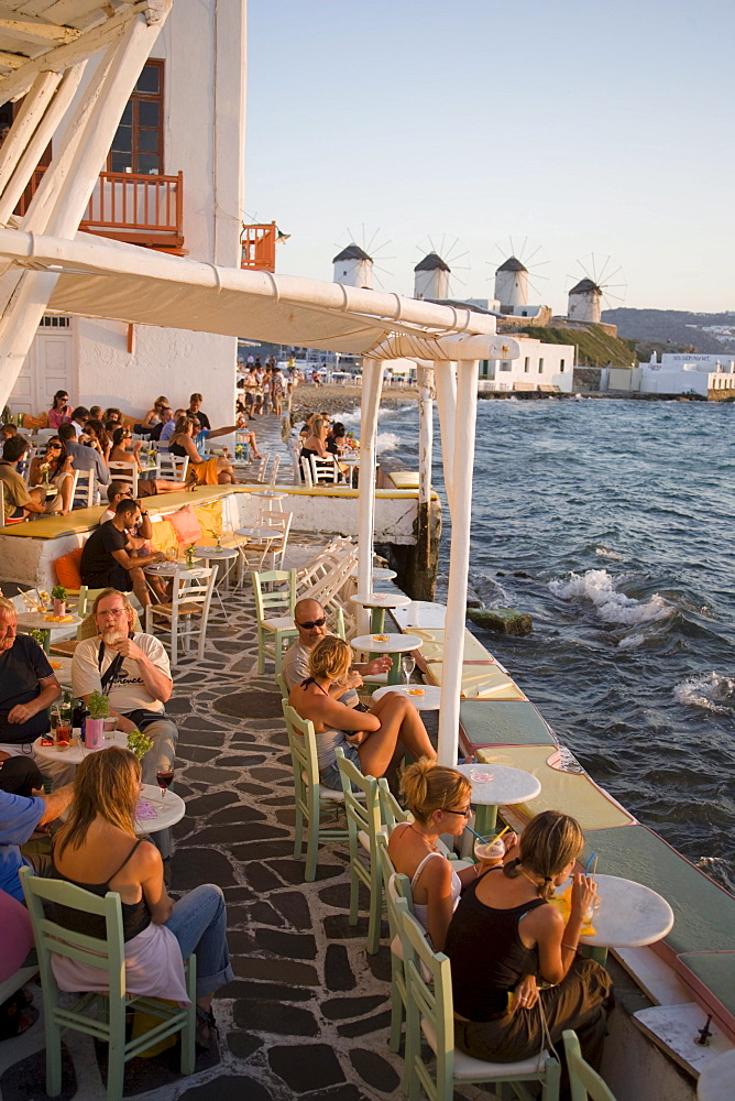 People sitting in restaurant directly at sea, Little Venice, Mykonos-Town, Mykonos, Greece