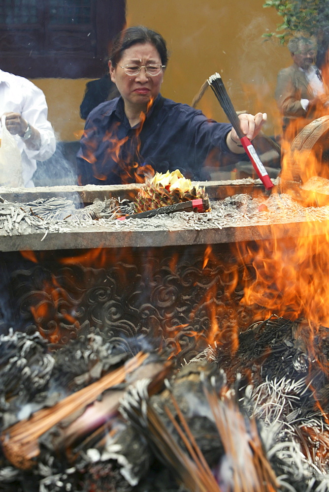 Longhua Temple, Longhua Temple and pagoda, oldest and largest buddhist temple in Shanghai, burning joss sticks, incense