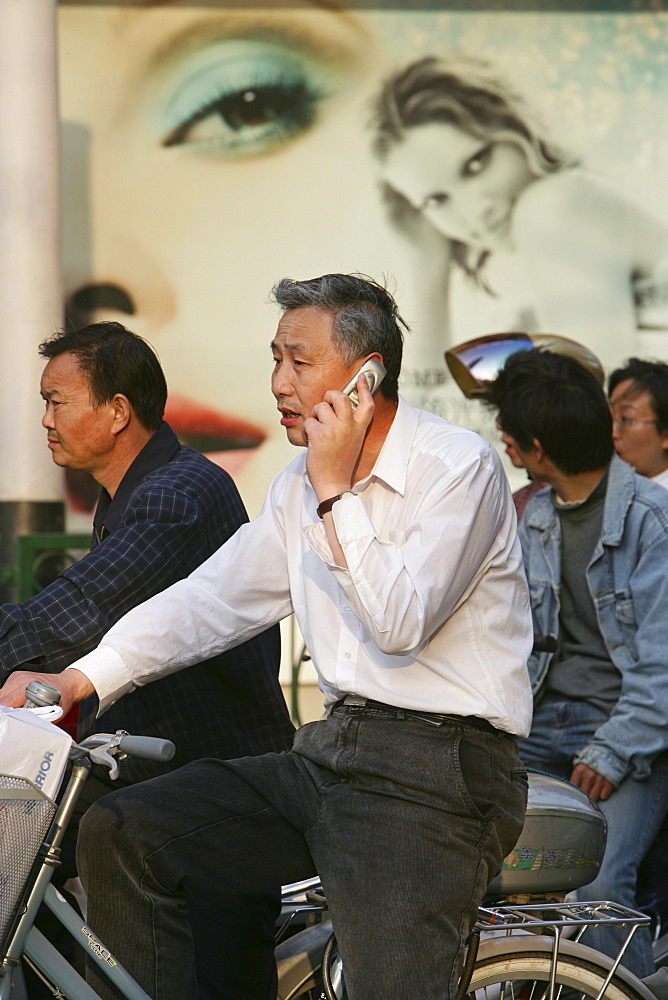 mobile phone, man on bike with mobile phone