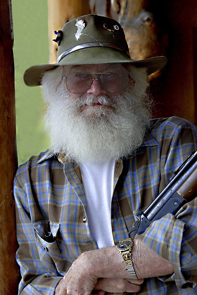 Man with Rifle in Alaska, USA00057231