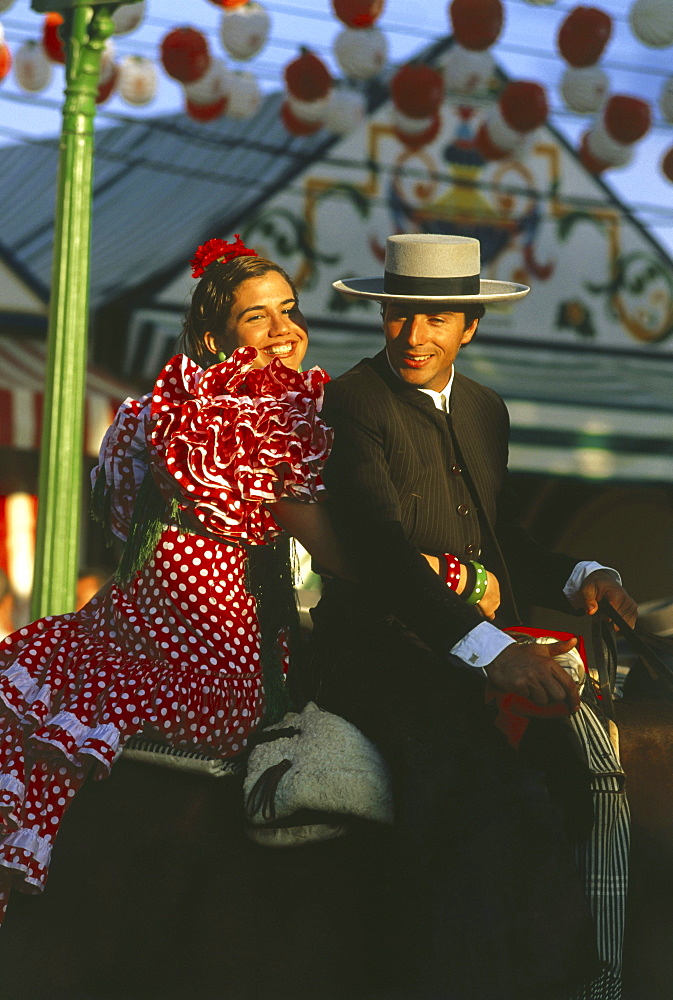 Couple on a horse, Feria de Abril, Sevilla, Andalusia, Spain111