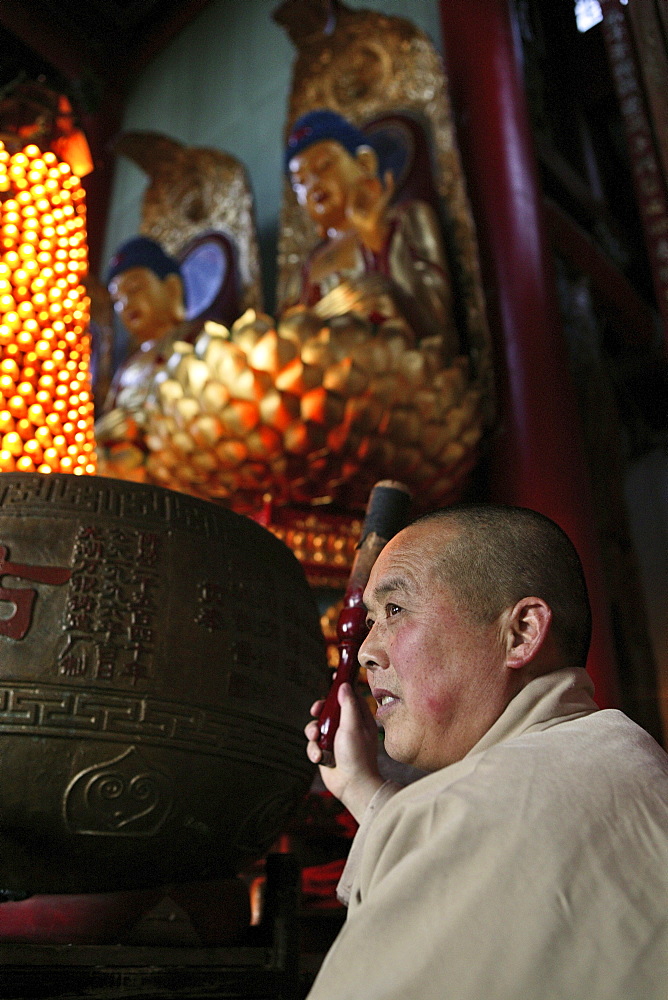 A monk at prayer service at Qiyuan monastery, Jiuhuashan, Anhui province, China, Asia