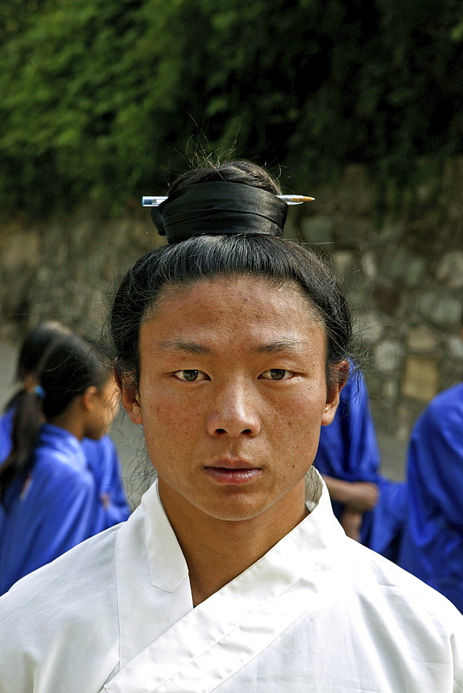 Taichi teacher with hair pinned up with a pen, Wudang School of Martial Arts, Purple Cloud Temple, Zi Xiao Gong, Mount Wudang, Wudang Shan, Taoist mountain, Hubei province, Wudangshan, Mount Wudang, UNESCO world cultural heritage site, birthplace of Tai chi, China