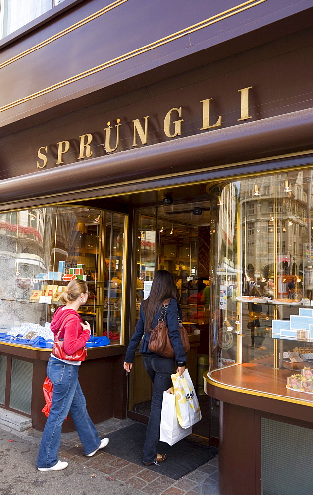 Two women entering the shop Spruengli (famous chocolate confectionery), Bahnhof Strasse, Zurich, Canton Zurich, Switzerland