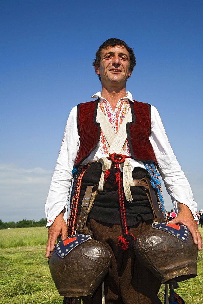 Man in traditional costume with bells, Rose Festival, Karlovo, Bulgaria, Europe