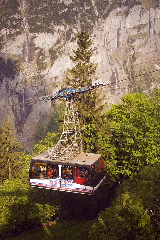 Fully occupied cabin of the Schilthornbahn on the way from Gimmelwald to Schilthorn, Gimmelwald near Muerren, Bernese Oberland (highlands), Canton of Bern, Switzerland