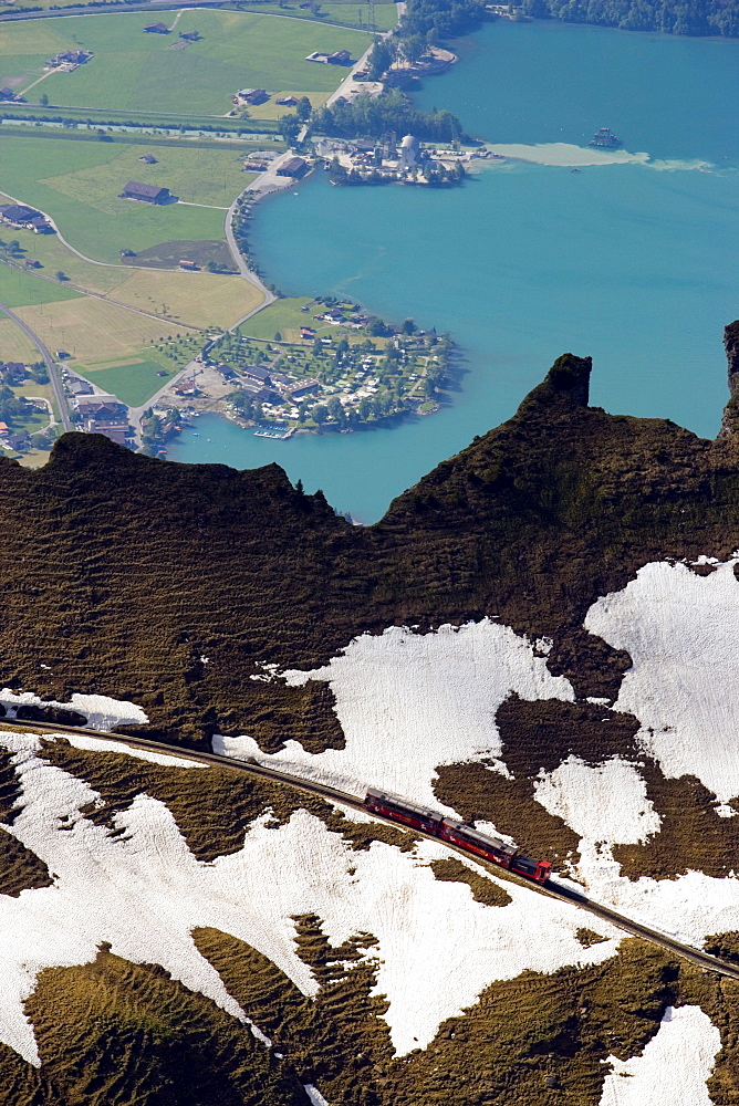 Aerial shot of Brienz Rothorn Railway (Switzerland's oldest cogwheel railway) and Lake Brienz, Brienz, Bernese Oberland (highlands), Canton of Bern, Switzerland