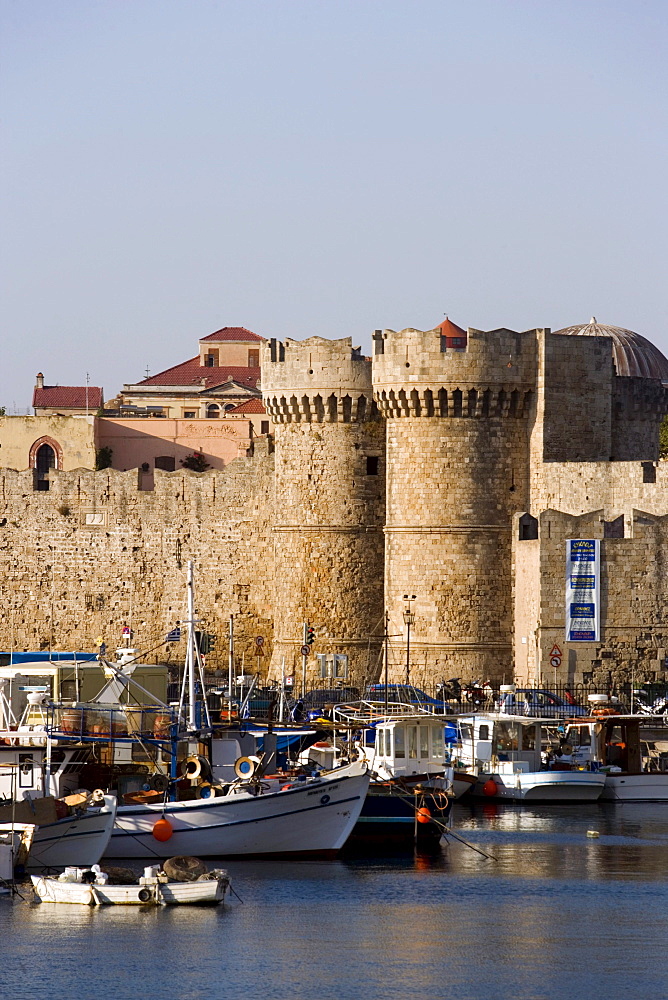 View over Emboria harbour to Thalassini Gate (sea gate, built 1502) entrance form Emborio harbour to mediaeval old town, Rhodes Town, Rhodes, Greece, (Since 1988 part of the UNESCO World Heritage Site)