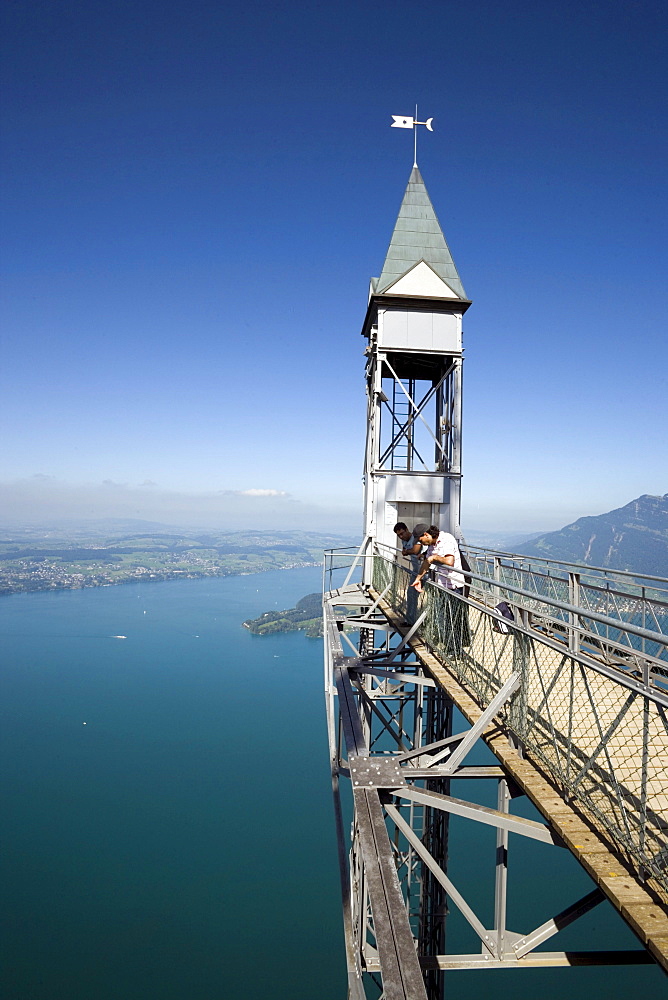 People standing on platform of Hammetschwand Elevator (153 m, highest exterior elevator of Europe) and looking down, Buergenstock (1128 m), Buergenstock, Canton Nidwalden, Switzerland