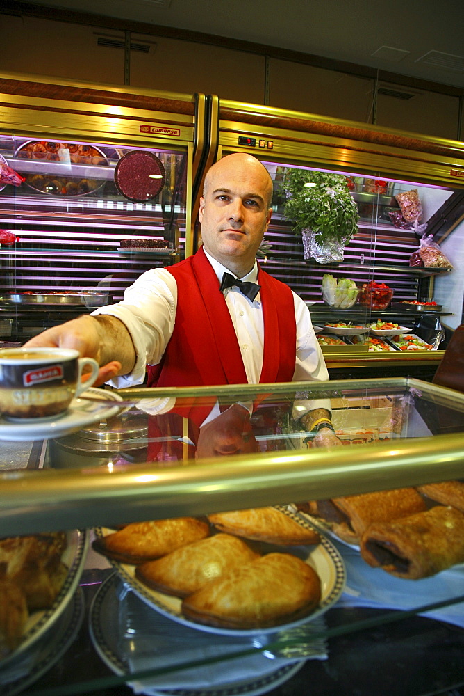 waiter in Cafe, red waistcoat, Valencia, Spanien