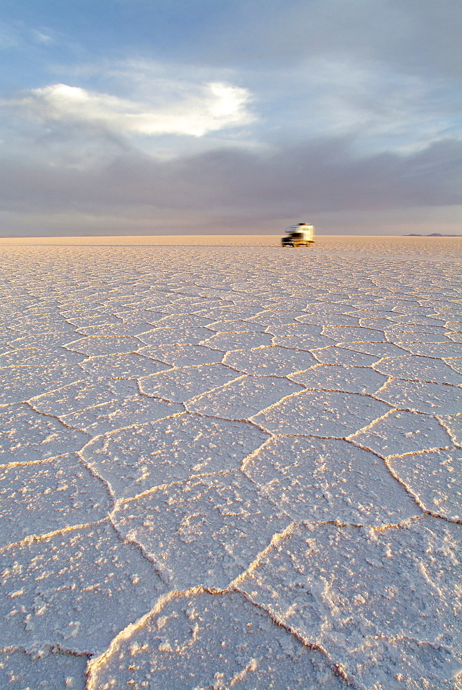 Car driving over the salt lake, Salar de Uyuni, Bolivia, South America