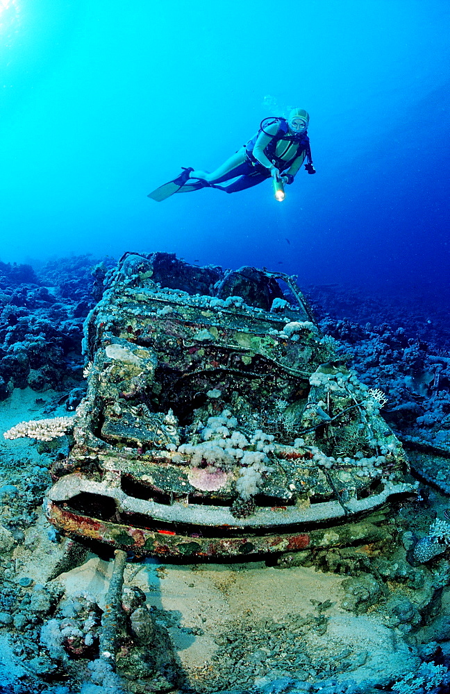 Scuba diver and Car wreck near Blue Belt shipwreck, Sudan, Africa, Red Sea