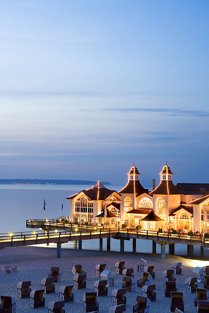 Sandy beach with beach chairs, pier in background, Sellin, Rugen island, Mecklenburg-Western Pomerania, Germany