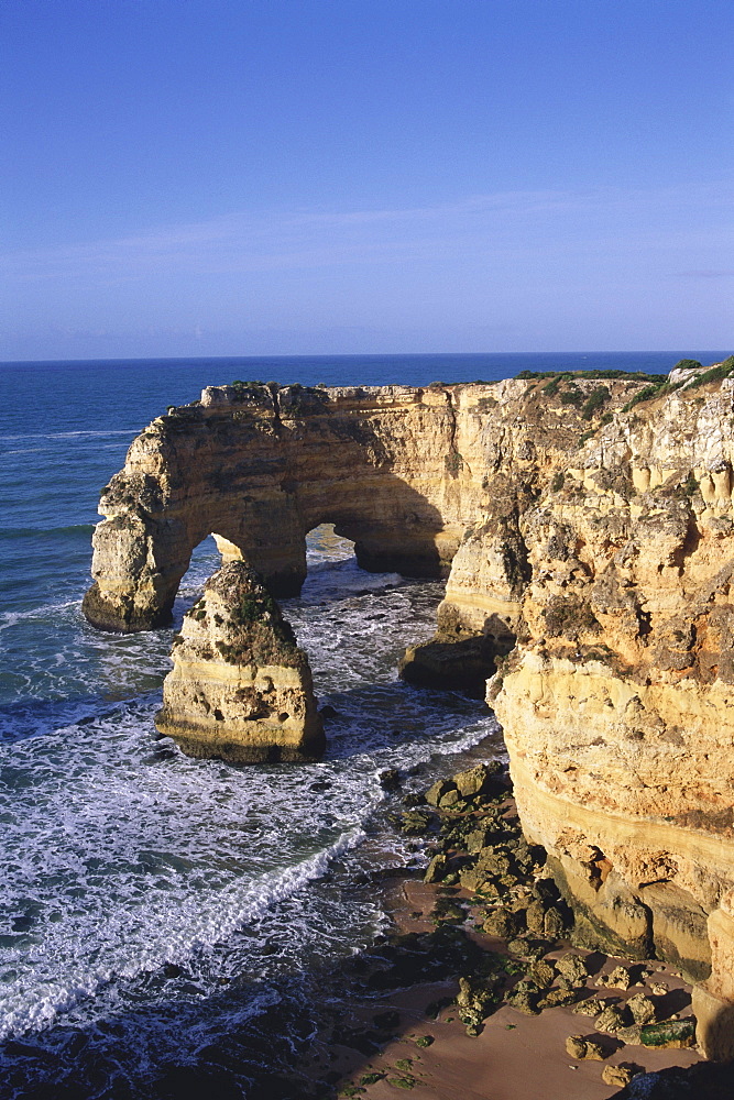 Rocky coastal landscape and cliff, Praia da Marina, Carvoeiro, Algarve, Portugal