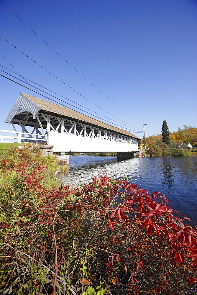 Covered bridge over a river in Northumberland, New Hampshire, USA