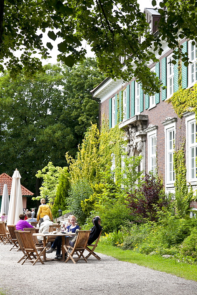 Guests sitting at tables in front of the main building, wellness hotel, Hotel Gutshaus Stellshagen, area Kluetzer Winkel, coast of the Baltic Sea, Stellshagen, Mecklenburg-West Pomerania, Germany