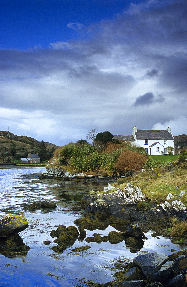 Cottage at Coulagh Bay under clouded sky, County Kerry, Ireland, Europe