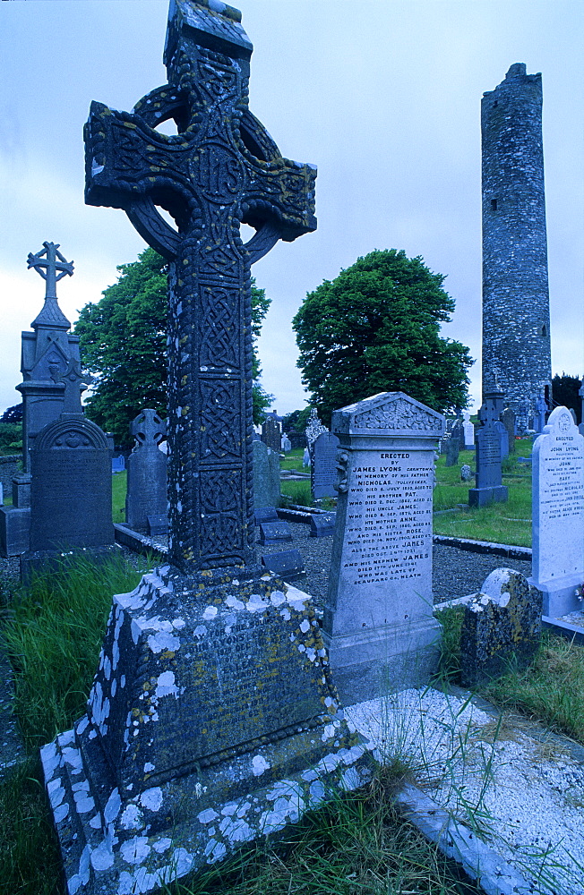 High crosses in front of the ruins of Monasterboice abbey at dusk, County Louth, Ireland, Europe