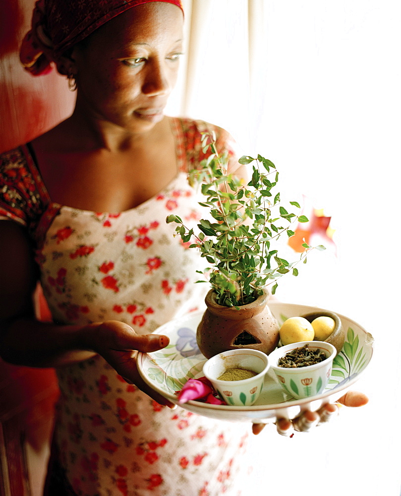 Therapist Acha shows ingredients for henna paste, Mrembo Spa, Mrembo means beautiful woman, old house in the center of Stone Town, Zanzibar, Tanzania, East Africa