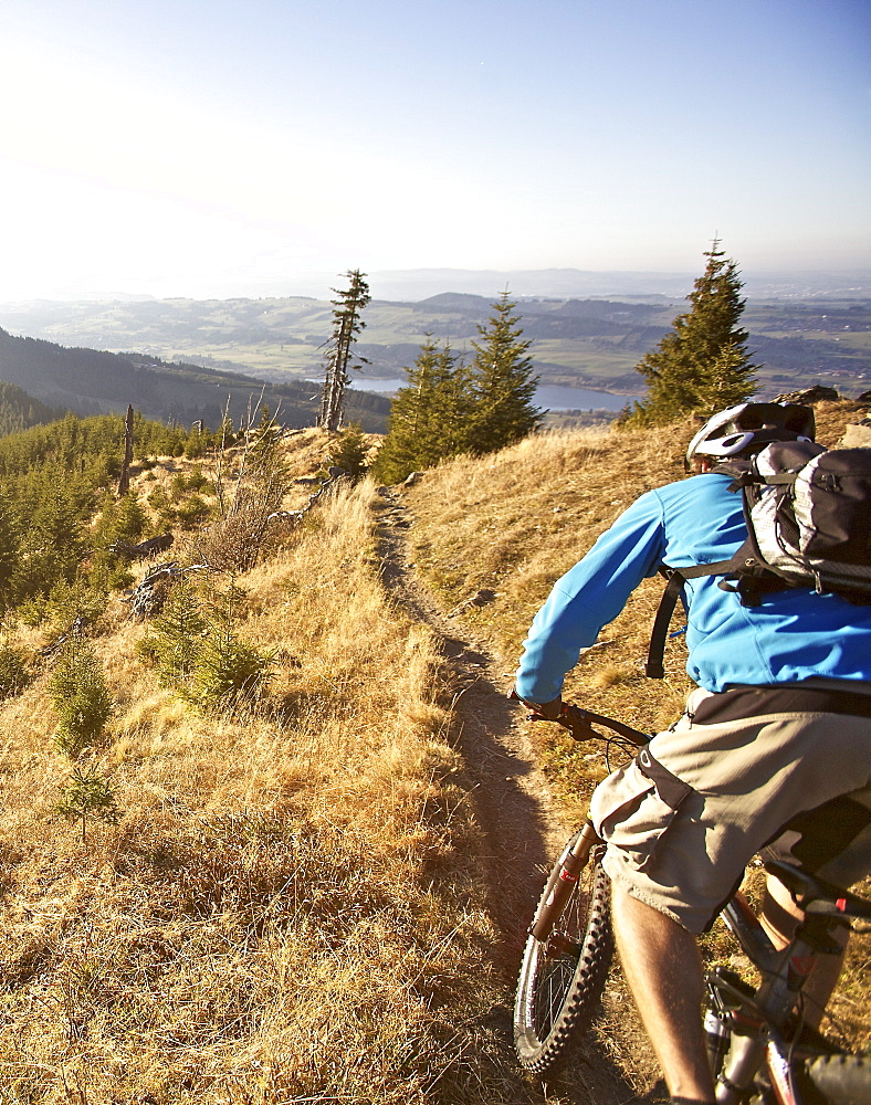 Mountainbiker riding on a trail in the Alps, Alpspitz, Bavaria, Germany, Europe