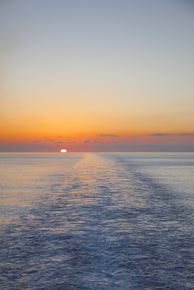 Sunset and wake of cruise ship MS Deutschland (Reederei Peter Deilmann), Caribbean Sea, near Cayman Islands