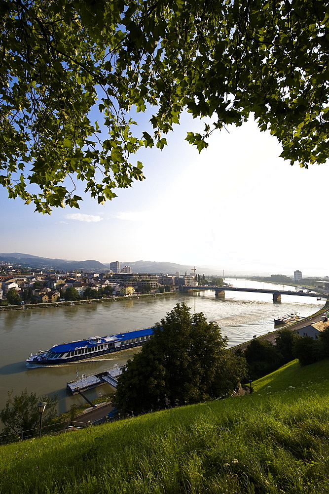 View from Schlossberg at the Danube with excursion boat and Nibelungen bridge, Linz, Upper Austria, Austria