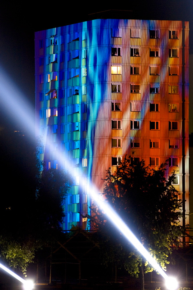 Beam of light and high rise building at night, Linz, Upper Austria, Austria .