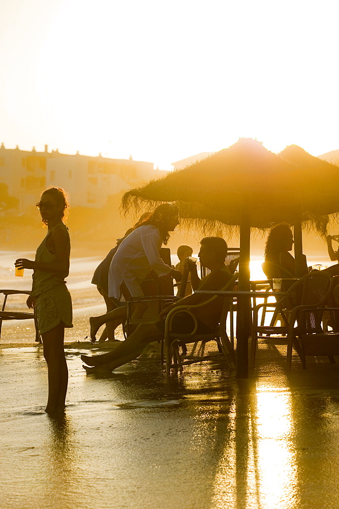 People at a beach bar at sunset, Los Canos de Meca, Andalusia, Spain, Europe