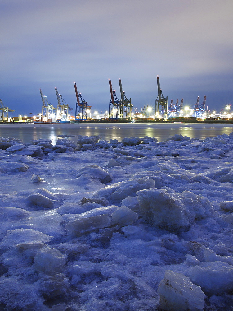 Frozen Elbe river with Waltershof container terminal in the evening, Hanseatic City of Hamburg, Germany, Europe