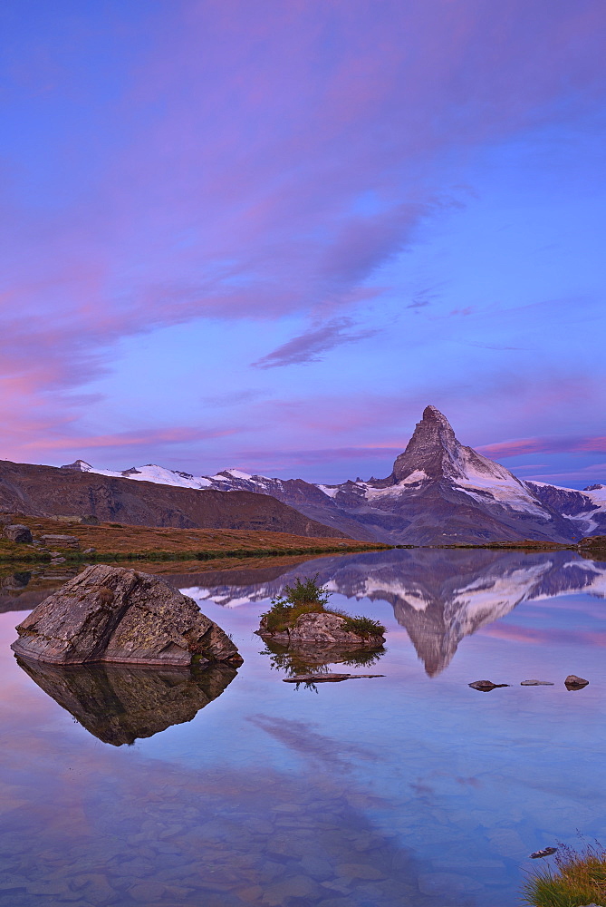 Matterhorn reflecting in a mountain lake, Pennine Alps, Valais, Switzerland