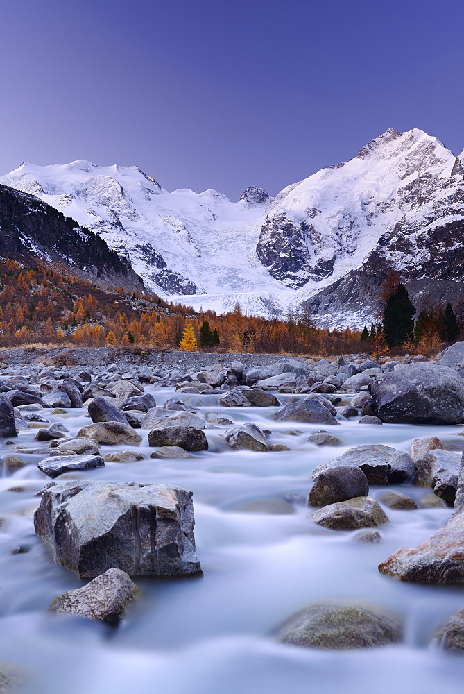 River flowing through Morteratsch valley at dawn with Bernina range in the background, Bernina range, Engadin, Grisons, Switzerland