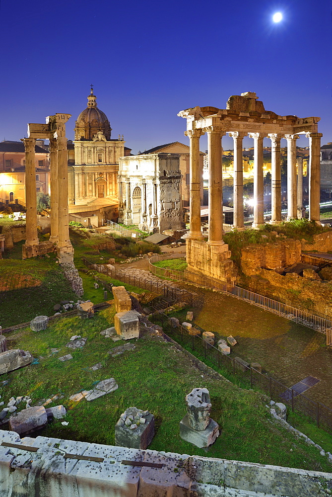 Illuminated Roman Forum at night with temple of saturn in the middle, UNESCO World Heritage Site Rome, Rome, Latium, Lazio, Italy