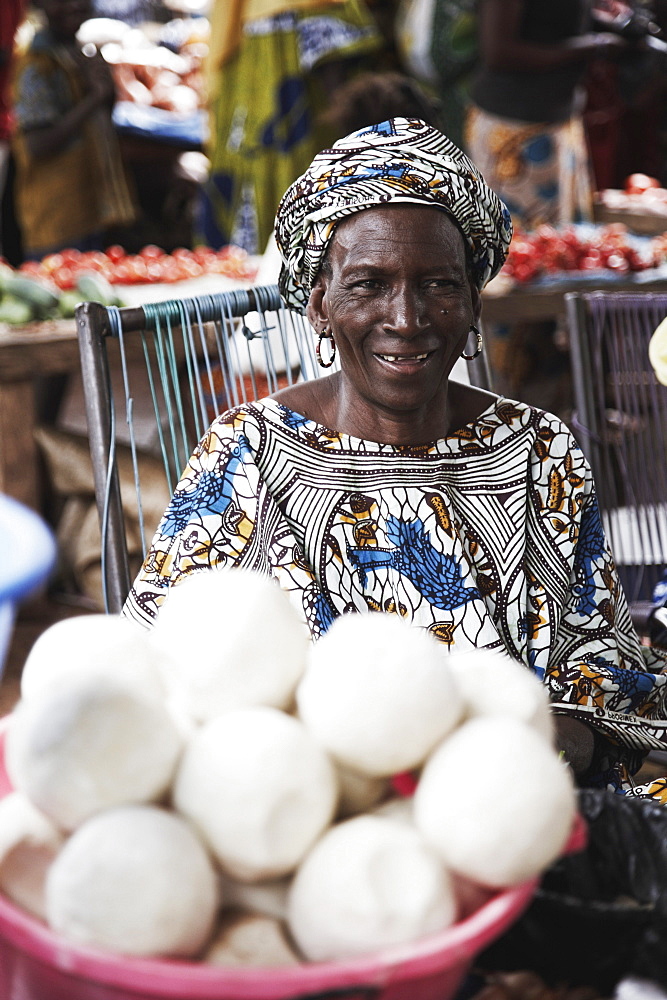 Woman offering soap at a market, Yanfolila, Sikasso Region, Mali