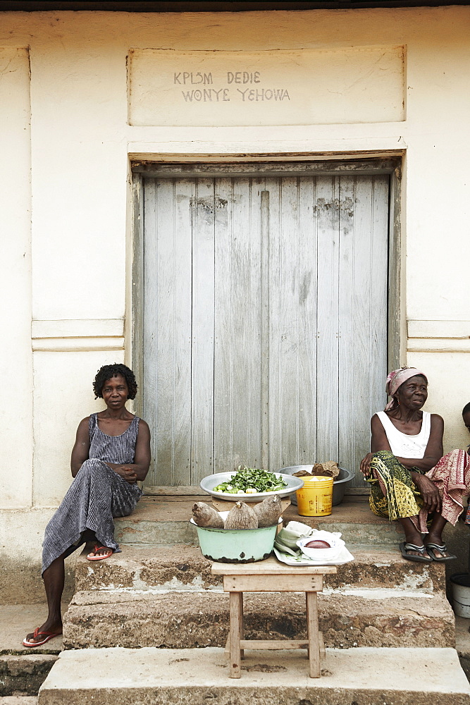 Market women sitting on stairs, Lake Volta, Asuogyaman District, Ghana